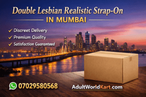 **Alt Text:**
Promotional banner for Double Lesbian Realistic Strap-On in Mumbai featuring city skyline at sunset, discreet delivery box, WhatsApp number 07029580568, and AdultWorldKart.com branding.